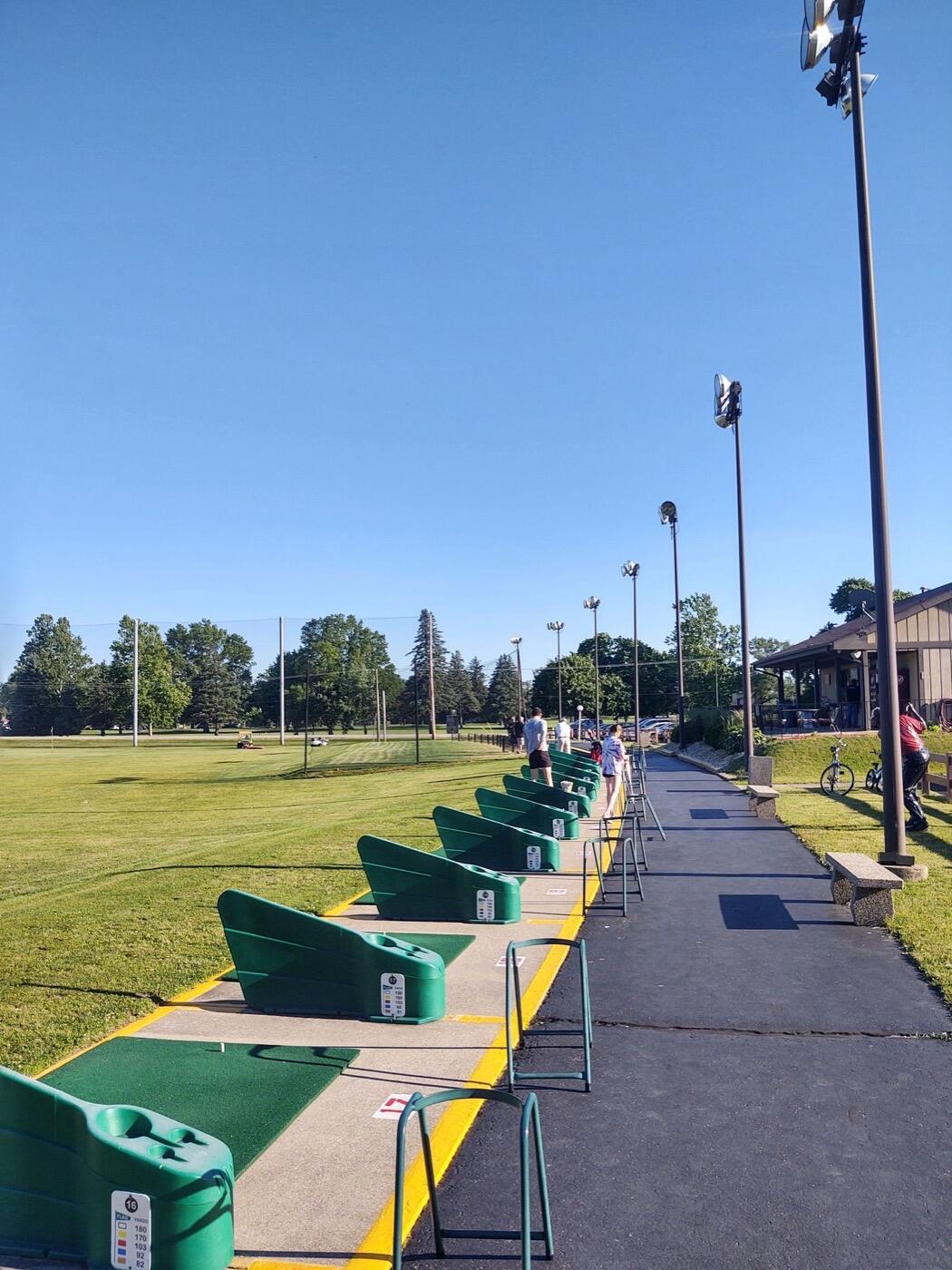 Driving range hitting bays